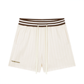 Apricot shorts with stripped waistband.